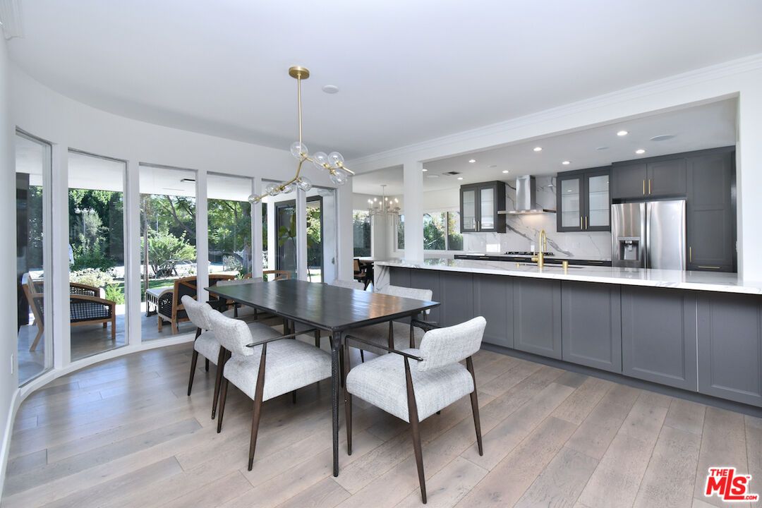 Dining room, Interior, Kitchen, Pendant Lights, Recessed Lighting, Stainless Steel Appliances, Wood Texture Flooring