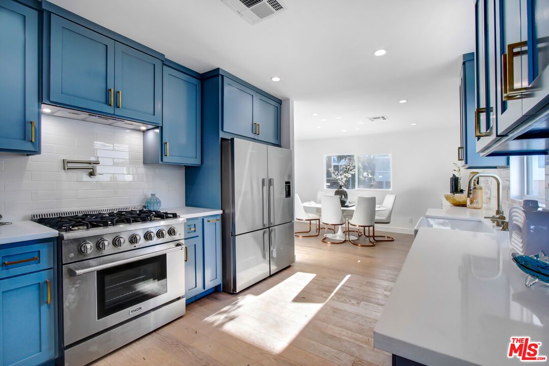 Dining room, Interior, Kitchen, Recessed Lighting, Stainless Steel Appliances, Wood Texture Flooring