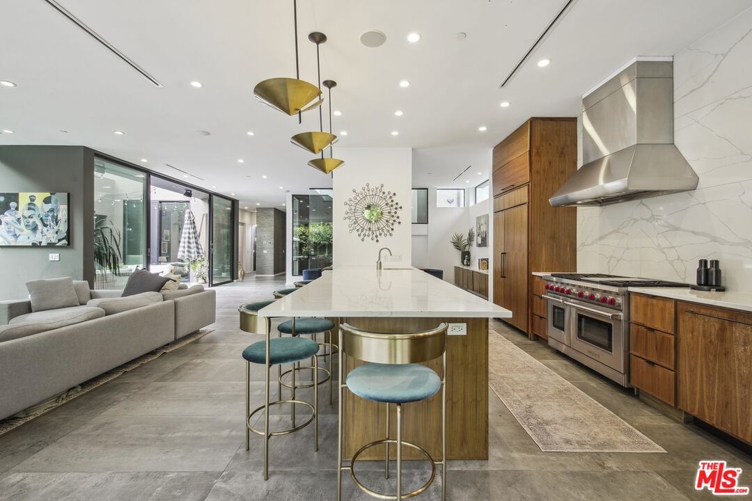 Interior, Kitchen, Living room, Marble Walls, Pendant Lights, Recessed Lighting, Stainless Steel Appliances, Wood Texture Flooring