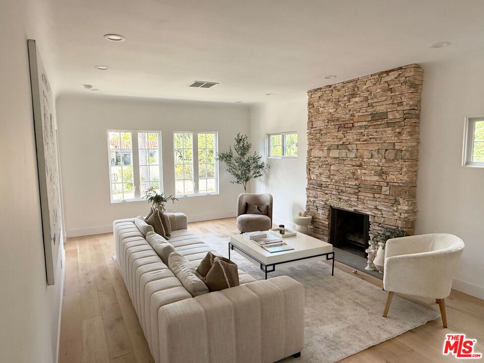 Fireplace, Interior, Living room, Recessed Lighting, Stone Walls, Wood Texture Flooring