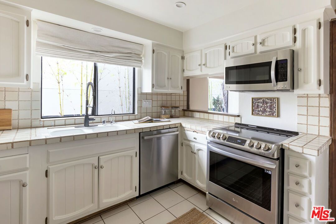 Interior, Kitchen, Recessed Lighting, Stainless Steel Appliances, Tile Countertops