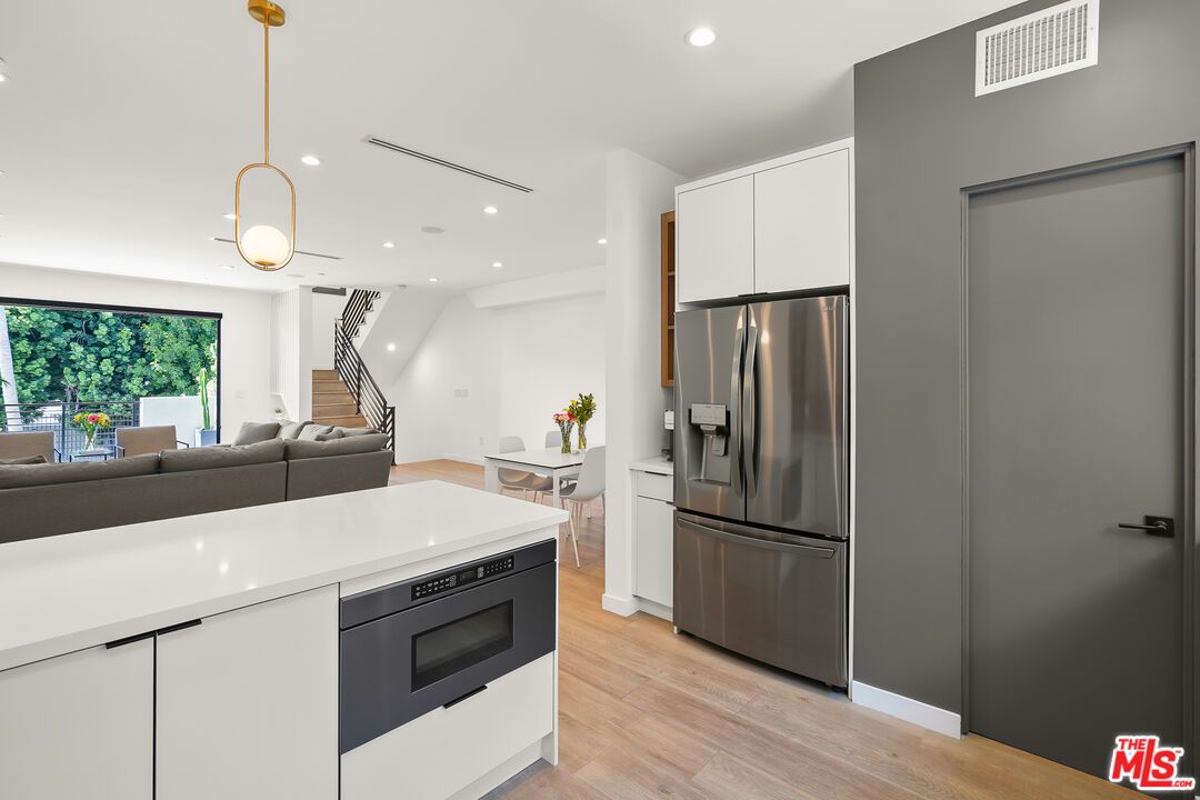Dining room, Interior, Kitchen, Pendant Lights, Recessed Lighting, Stainless Steel Appliances, Wood Texture Flooring