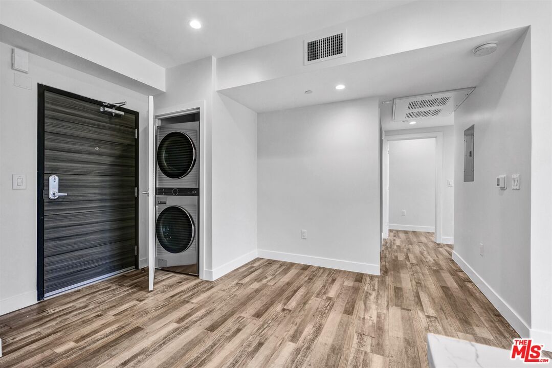 Empty room, Interior, Recessed Lighting, Utility Closets, Washer, Wood Texture Flooring