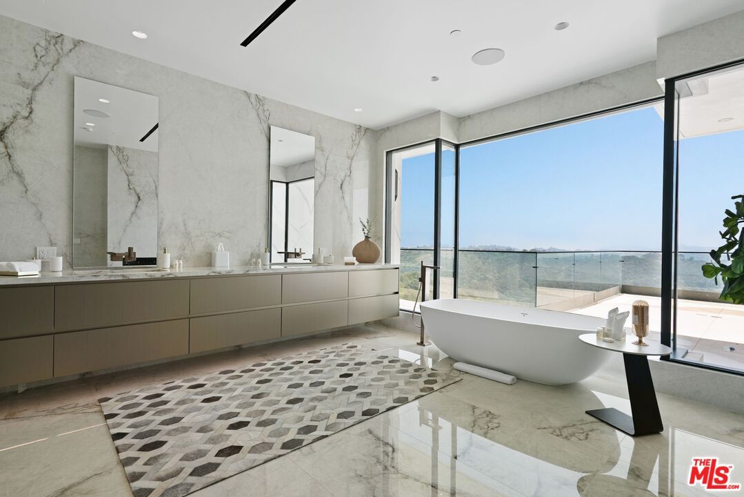 Bathroom, Free Standing Baths, Glass Shower, Interior, Marble Walls, Recessed Lighting, Water