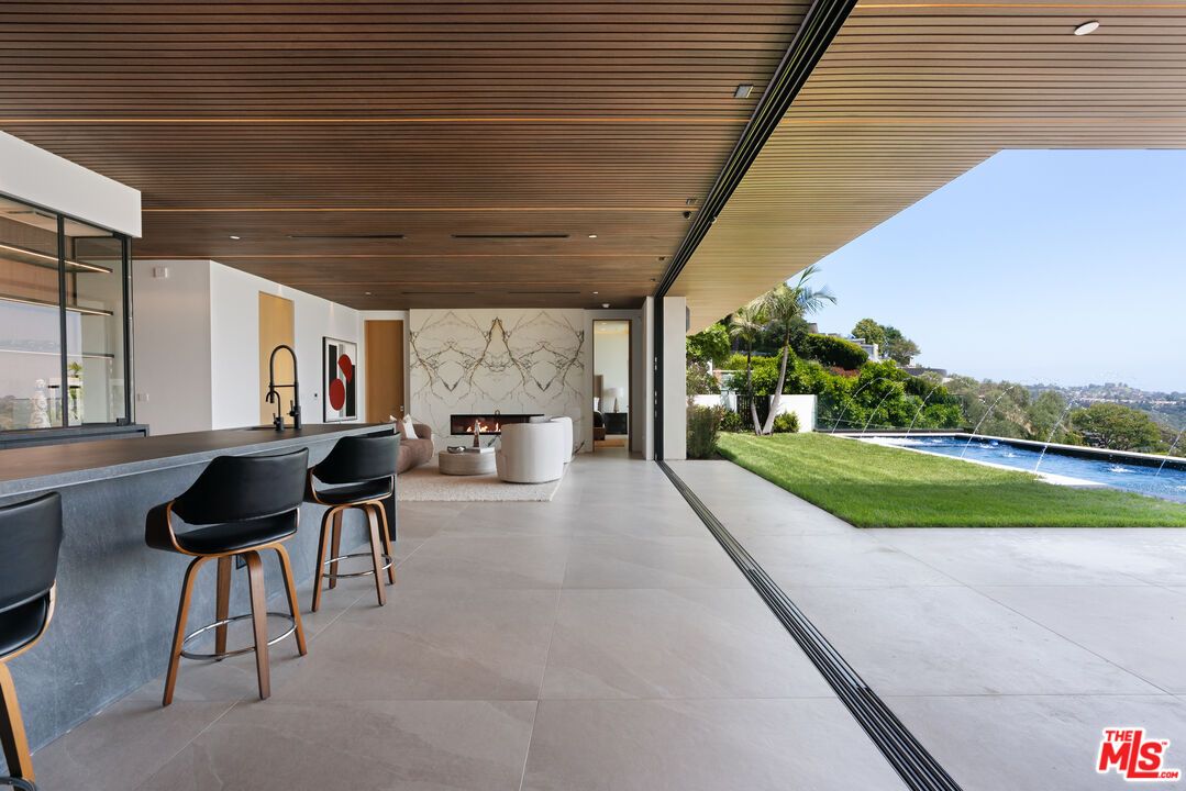 Exterior, Fireplace, Outdoor Kitchen, Water