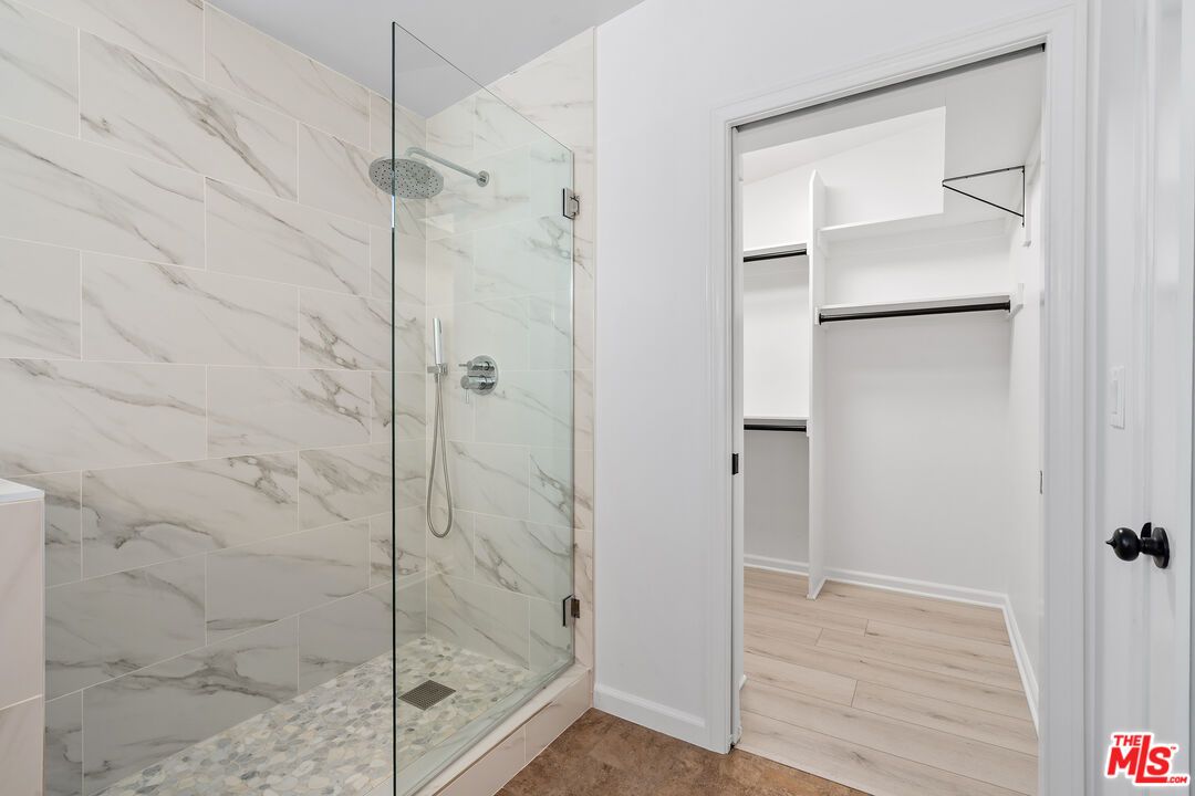 Bathroom, Glass Shower, Interior, Marble Walls, Wood Texture Flooring