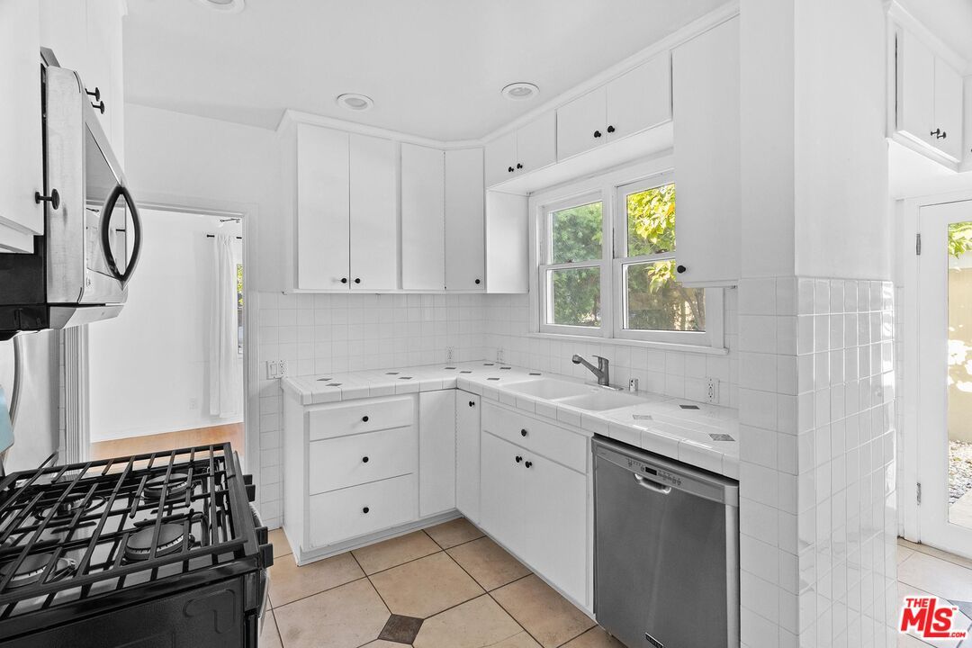 Interior, Kitchen, Recessed Lighting, Stainless Steel Appliances, Tile Countertops