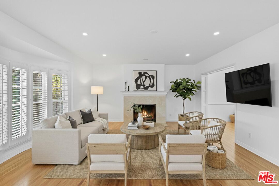 Dining room, Fireplace, Interior, Living room, Recessed Lighting, Wood Texture Flooring