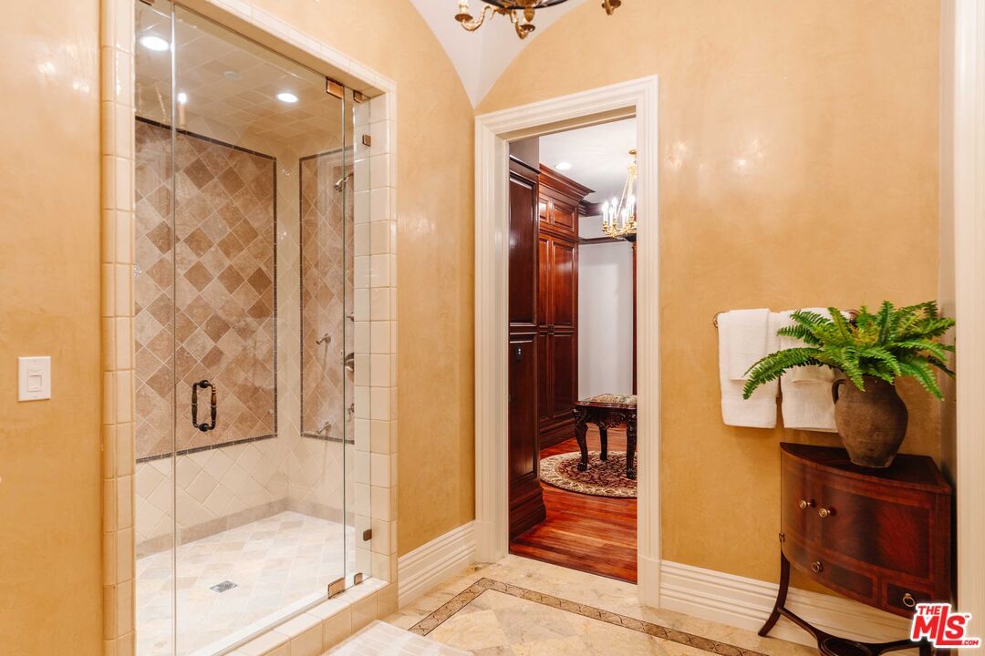 Bathroom, Chandelier, Glass Shower, Interior, Recessed Lighting, Wood Texture Flooring