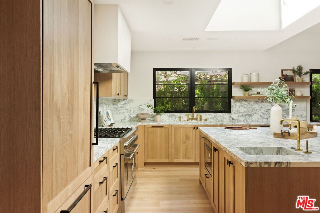 Interior, Kitchen, Marble Walls, Recessed Lighting, Stainless Steel Appliances, Wood Texture Flooring