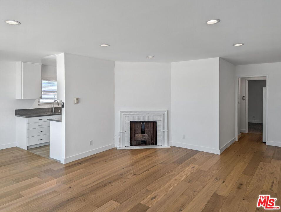 Empty room, Fireplace, Interior, Recessed Lighting, Wood Texture Flooring
