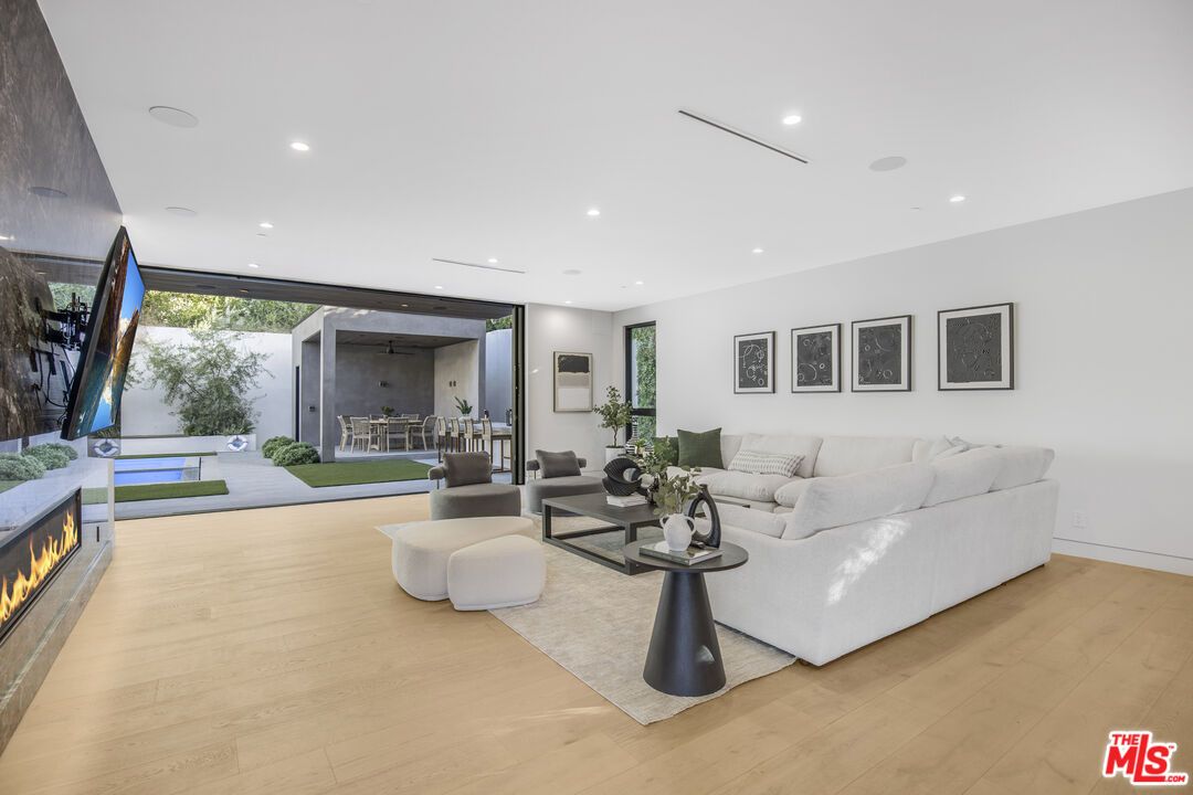 Dining room, Fireplace, Interior, Living room, Recessed Lighting, Wood Texture Flooring