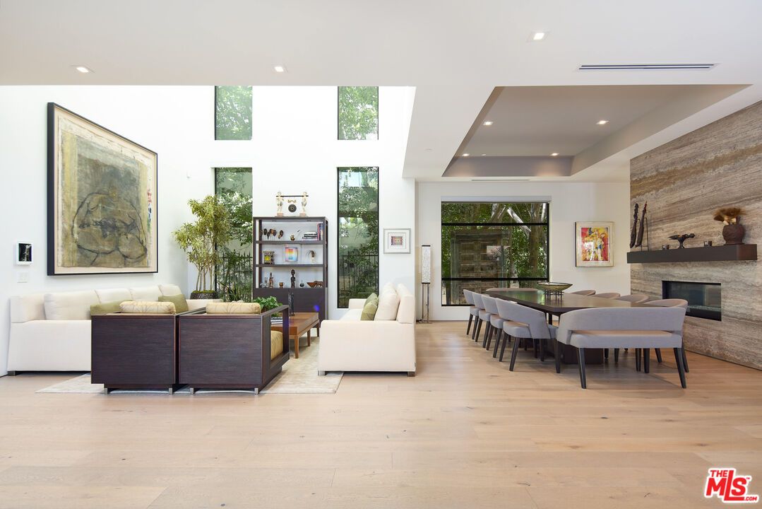 Dining room, Fireplace, Interior, Living room, Recessed Lighting, Stone Walls, Wood Texture Flooring