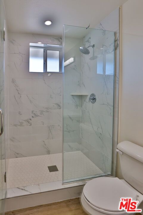 Bathroom, Glass Shower, Interior, Marble Walls, Recessed Lighting, Wood Texture Flooring