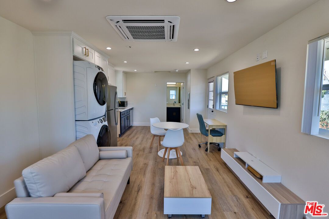 Dining room, Interior, Living room, Recessed Lighting, Utility Closets, Washer, Wood Texture Flooring