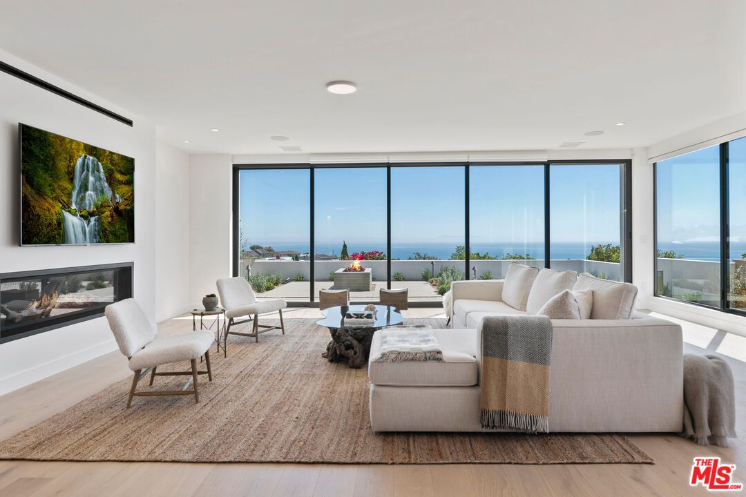 Fireplace, Interior, Living room, Recessed Lighting, Water, Wood Texture Flooring