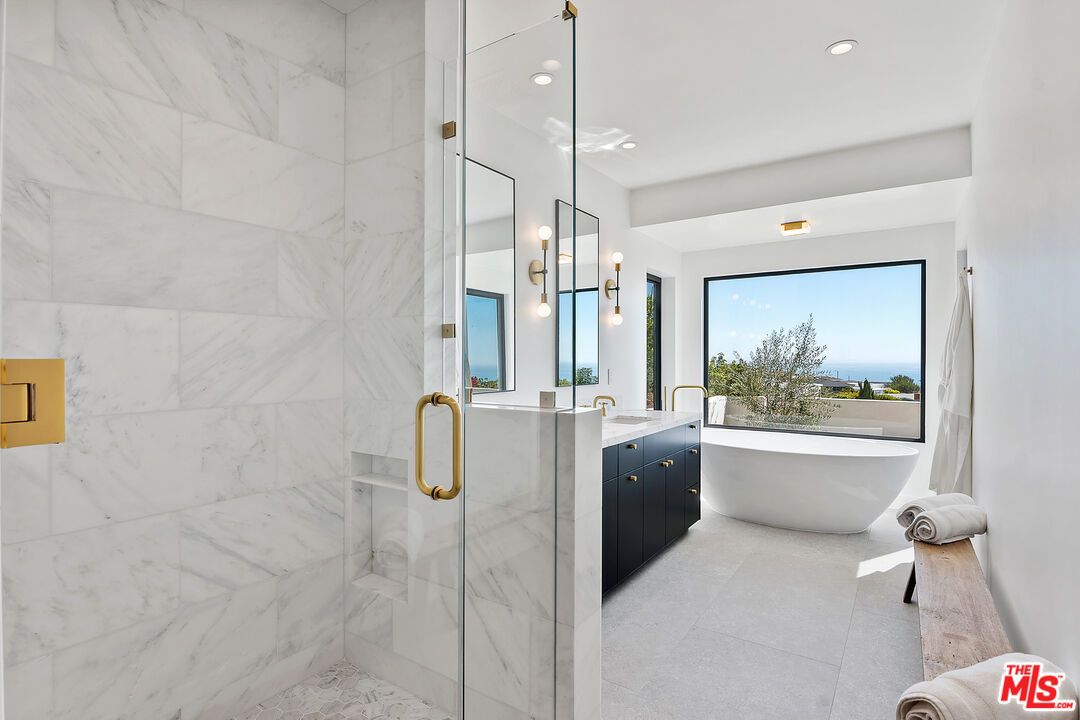 Bathroom, Dual Sink Vanities, Free Standing Baths, Glass Shower, Interior, Marble Walls, Recessed Lighting, Water