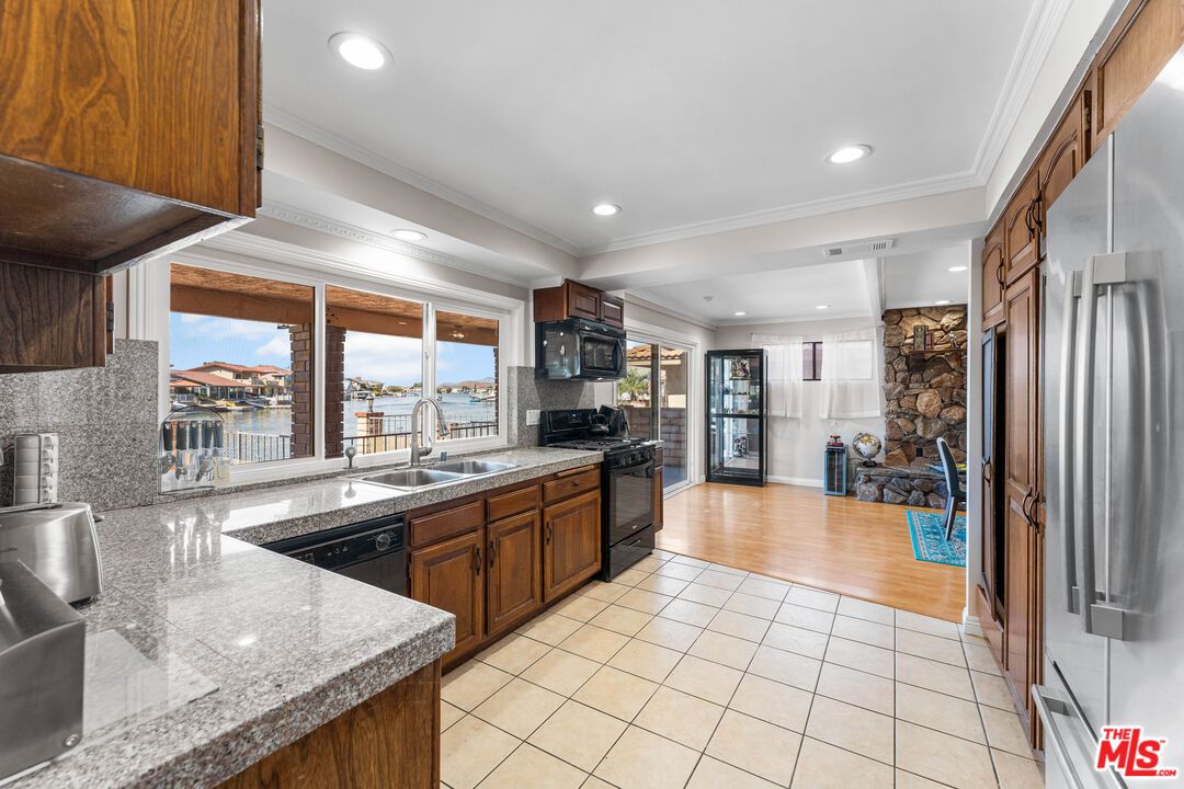 Interior, Kitchen, Recessed Lighting, Stainless Steel Appliances, Stone Walls, Water, Wood Texture Flooring