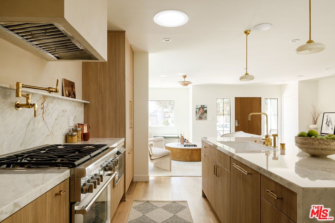 Interior, Kitchen, Living room, Marble Walls, Pendant Lights, Recessed Lighting, Stainless Steel Appliances, Wood Texture Flooring