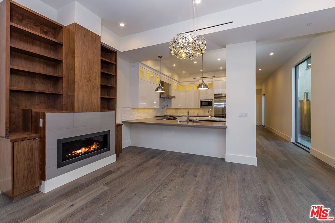 Fireplace, Interior, Kitchen, Pendant Lights, Recessed Lighting, Stainless Steel Appliances, Wood Texture Flooring