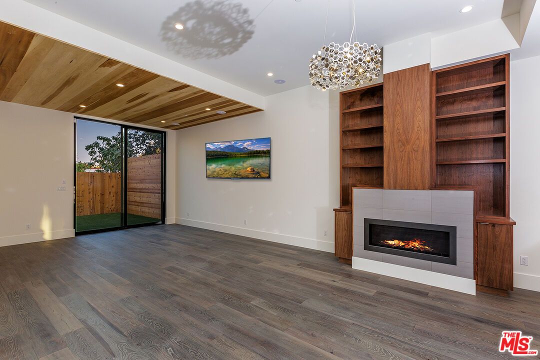 Empty room, Fireplace, Interior, Pendant Lights, Recessed Lighting, Wooden Ceilings, Wood Texture Flooring