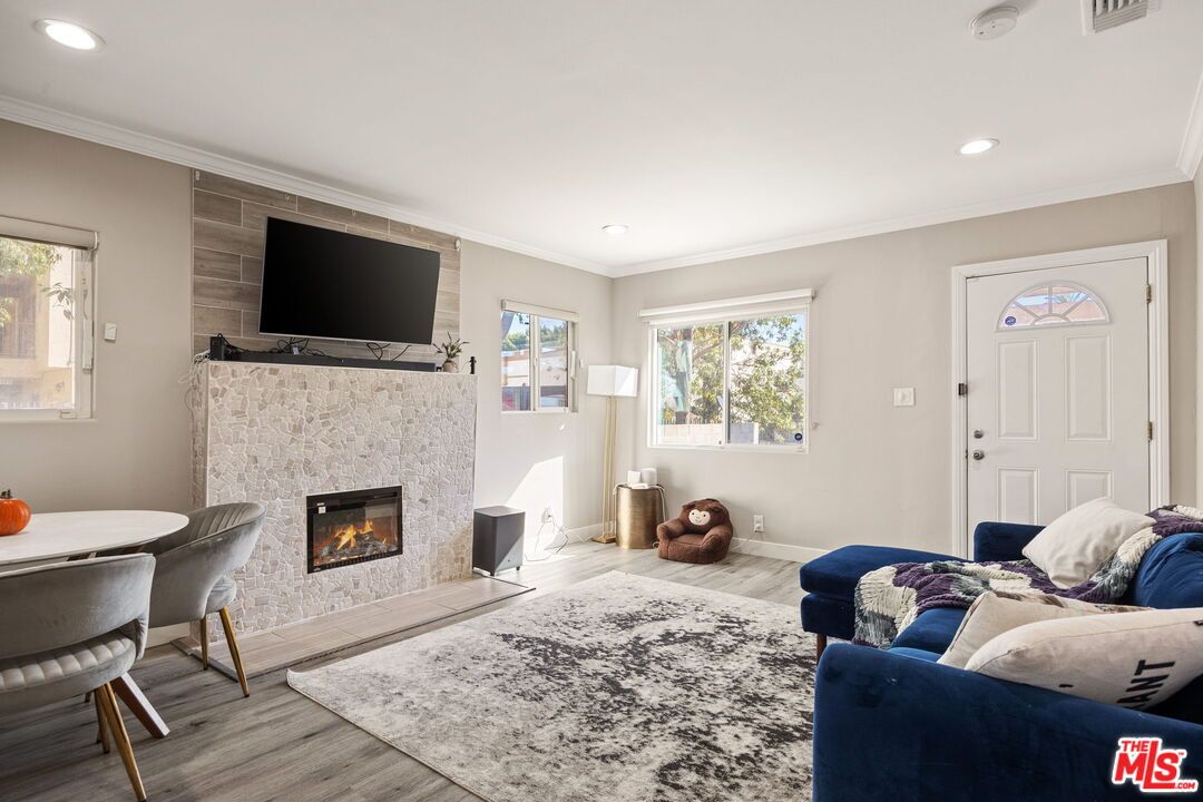 Dining room, Fireplace, Interior, Living room, Recessed Lighting, Wood Texture Flooring