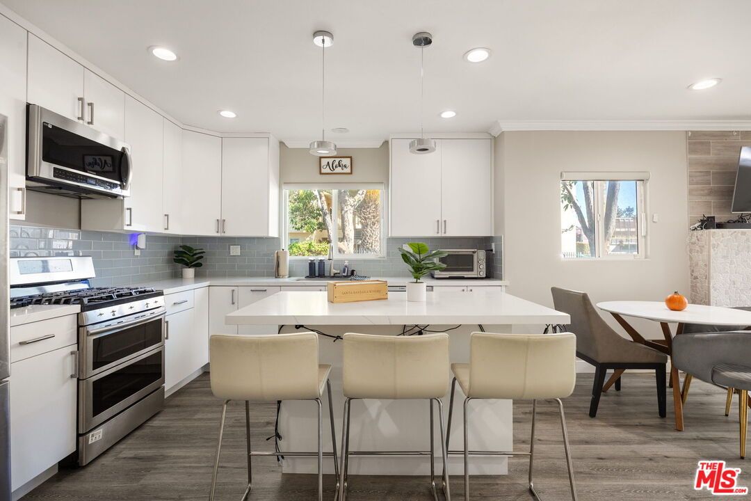 Dining room, Interior, Kitchen, Pendant Lights, Recessed Lighting, Stainless Steel Appliances, Wood Texture Flooring
