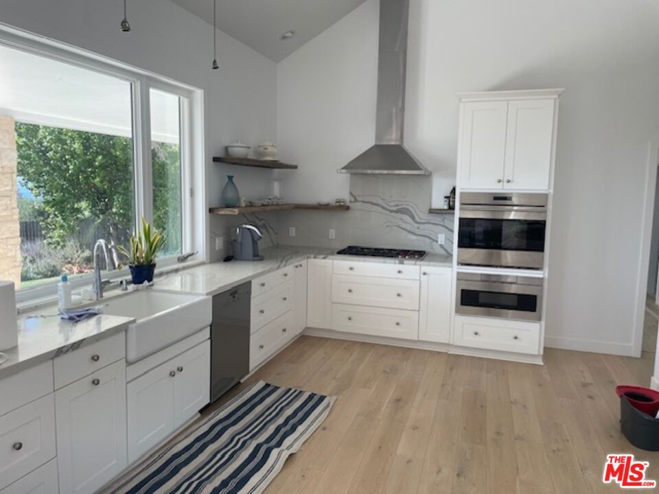Interior, Kitchen, Marble Walls, Recessed Lighting, Stainless Steel Appliances, Wood Texture Flooring