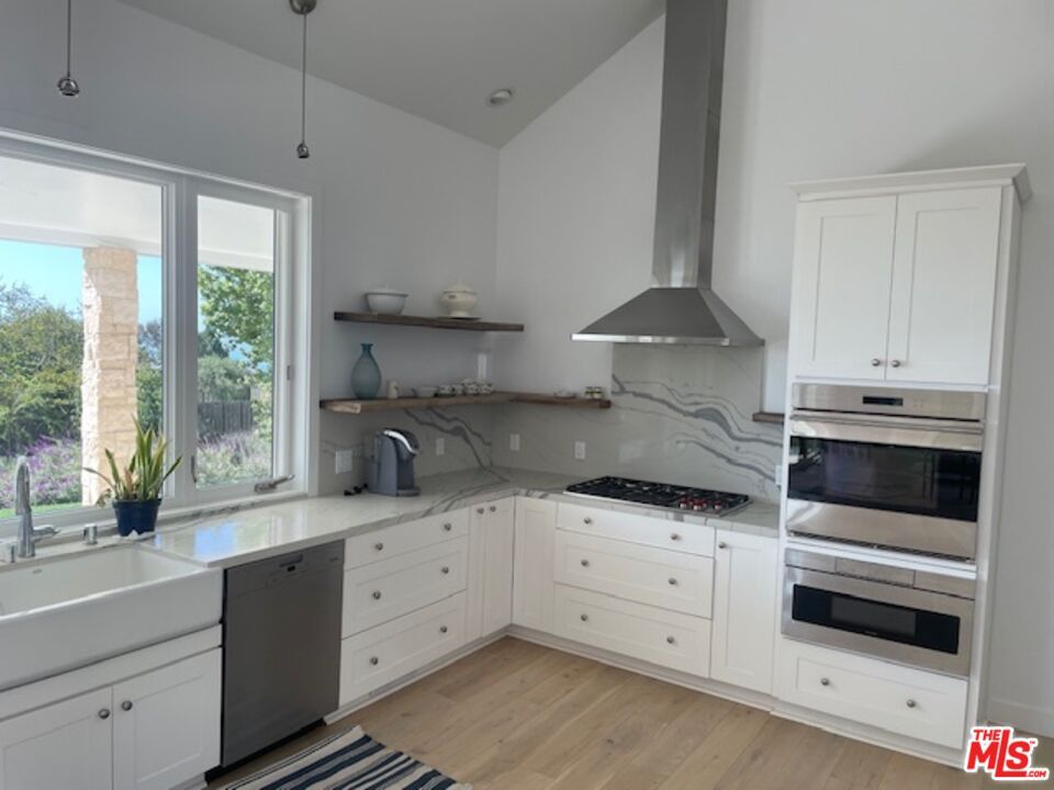 Interior, Kitchen, Marble Walls, Recessed Lighting, Stainless Steel Appliances, Wood Texture Flooring