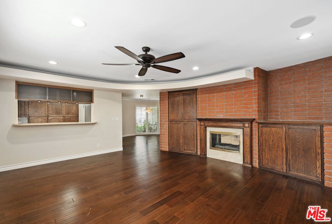 Empty room, Fireplace, Interior, Recessed Lighting, Stone Walls, Wood Texture Flooring