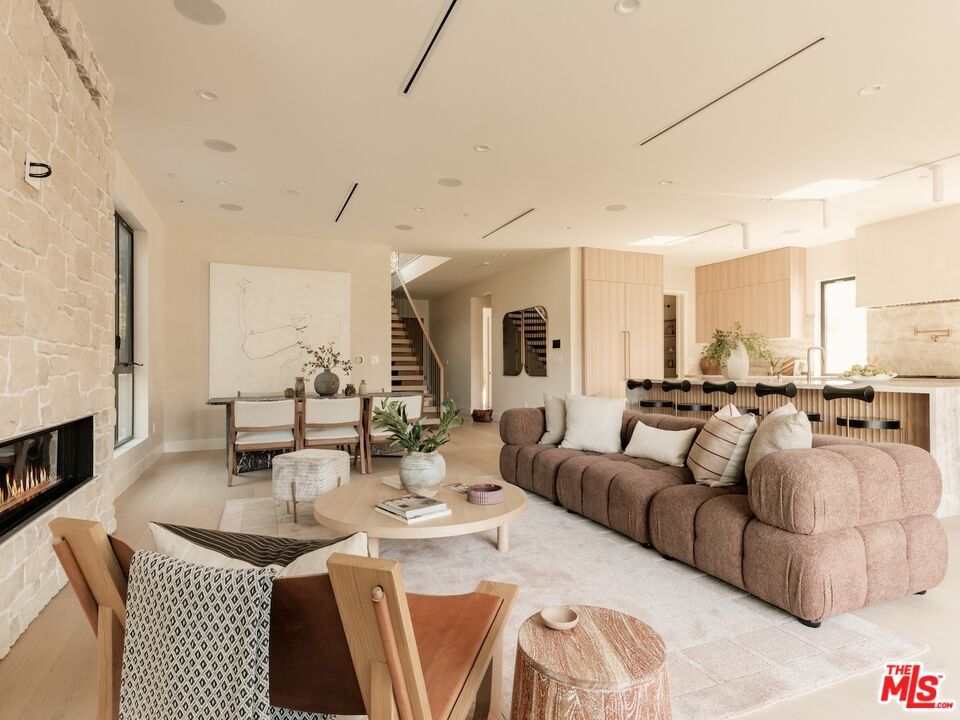 Dining room, Fireplace, Interior, Kitchen, Living room, Recessed Lighting, Stone Walls, Wood Texture Flooring