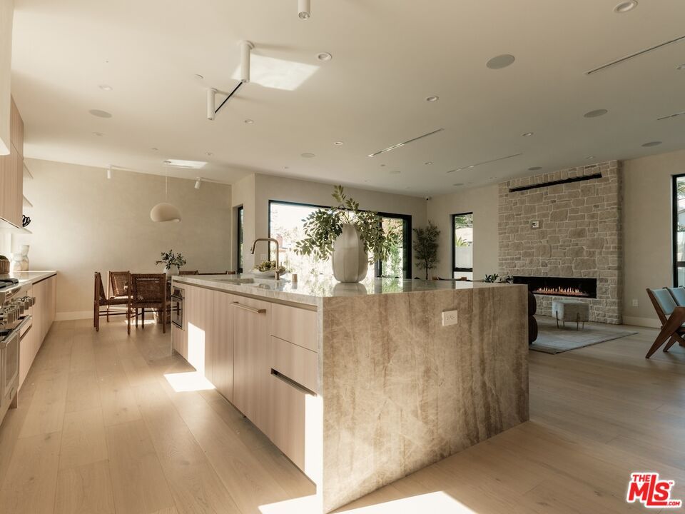 Dining room, Fireplace, Interior, Kitchen, Pendant Lights, Recessed Lighting, Stone Walls, Wood Texture Flooring