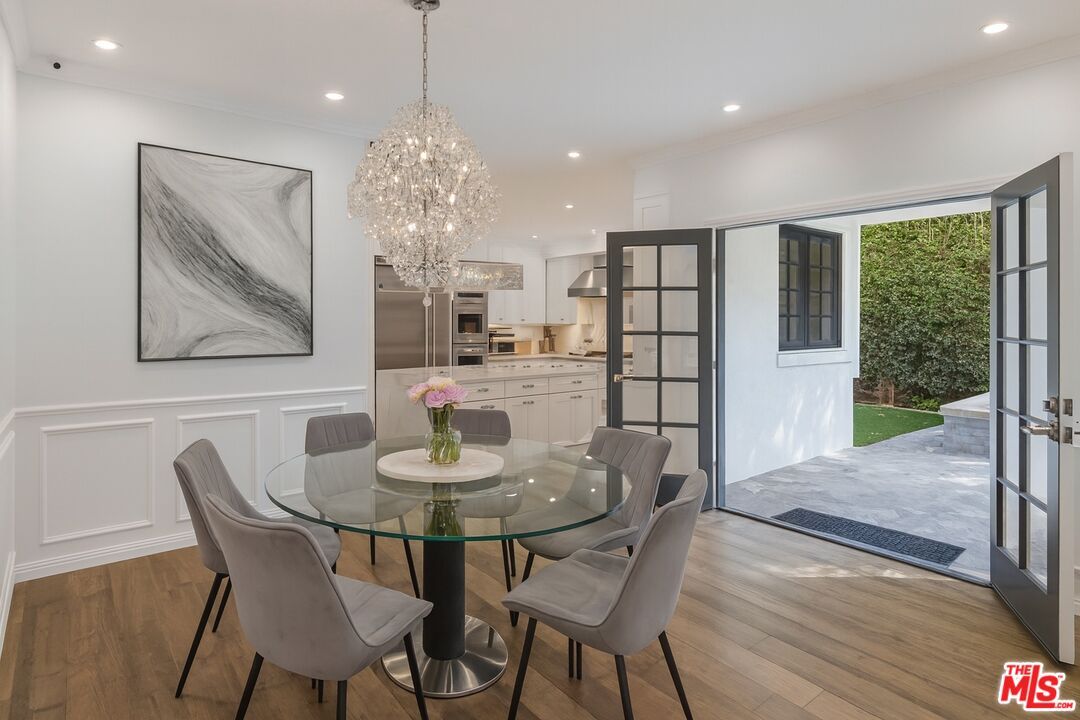 Chandelier, Dining room, Interior, Kitchen, Recessed Lighting, Stainless Steel Appliances, Wood Texture Flooring