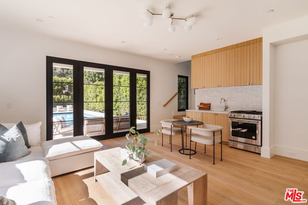 Dining room, Interior, Kitchen, Living room, Recessed Lighting, Stainless Steel Appliances, Wood Texture Flooring