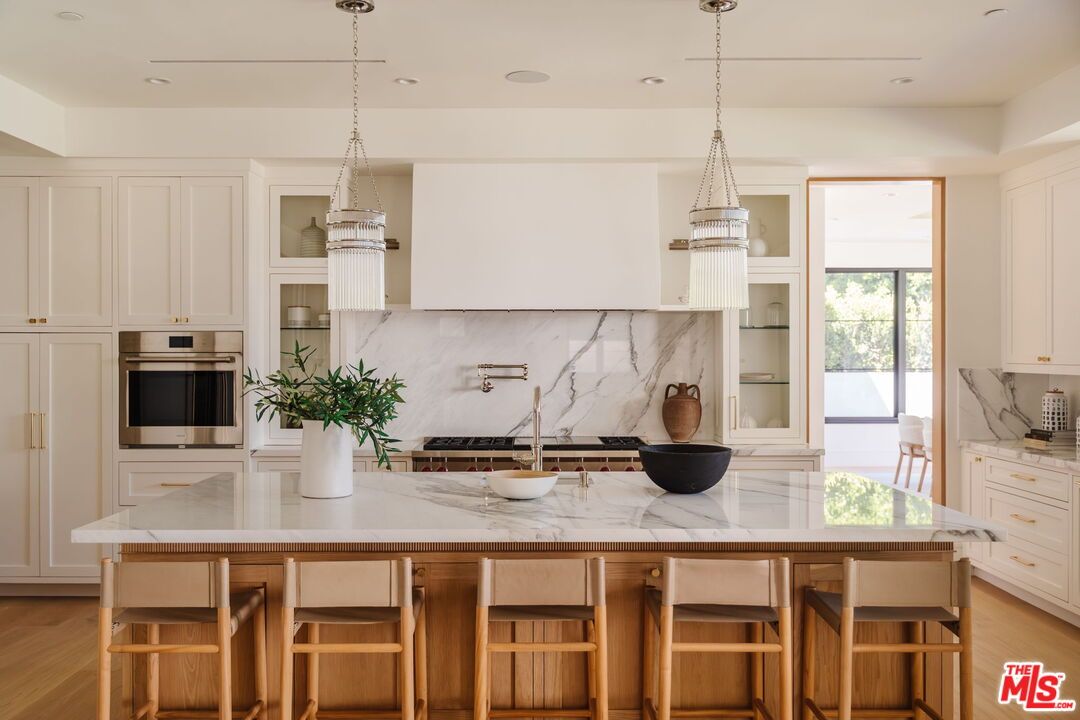 Interior, Kitchen, Marble Walls, Pendant Lights, Recessed Lighting, Stainless Steel Appliances, Wood Texture Flooring