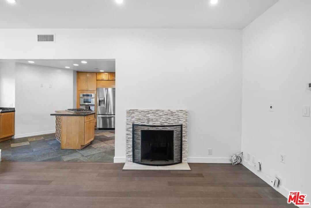Fireplace, Interior, Kitchen, Recessed Lighting, Stainless Steel Appliances, Wood Texture Flooring