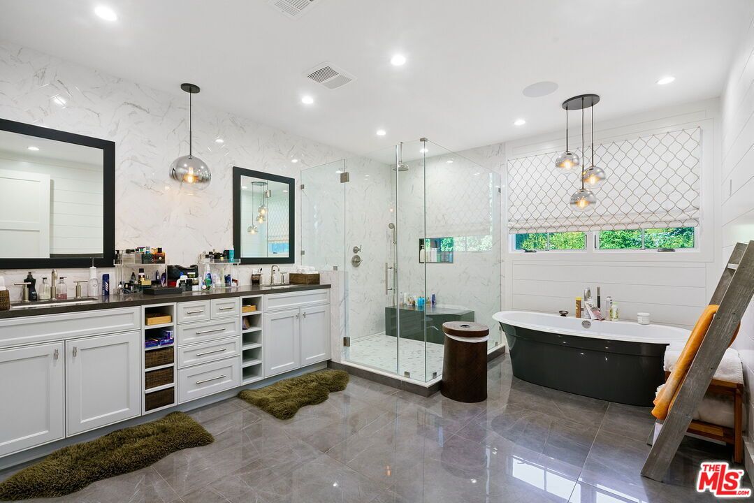 Bathroom, Dual Sink Vanities, Free Standing Baths, Glass Shower, Interior, Marble Walls, Pendant Lights, Recessed Lighting