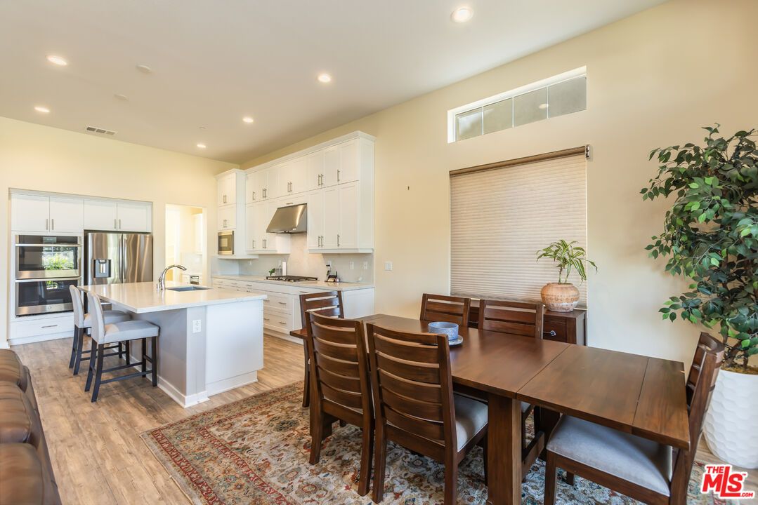 Dining room, Interior, Kitchen, Recessed Lighting, Stainless Steel Appliances, Wood Texture Flooring