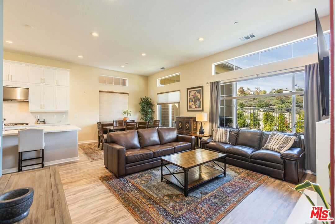 Dining room, Interior, Kitchen, Living room, Recessed Lighting, Stainless Steel Appliances, Wood Texture Flooring