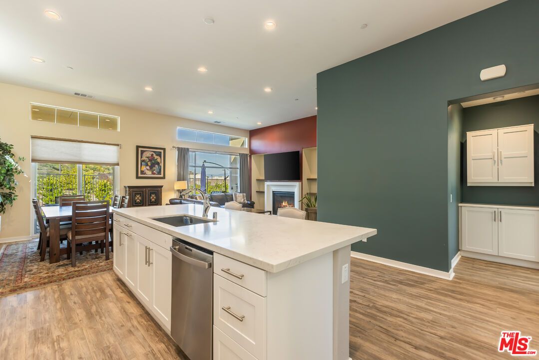 Dining room, Fireplace, Interior, Kitchen, Recessed Lighting, Wood Texture Flooring