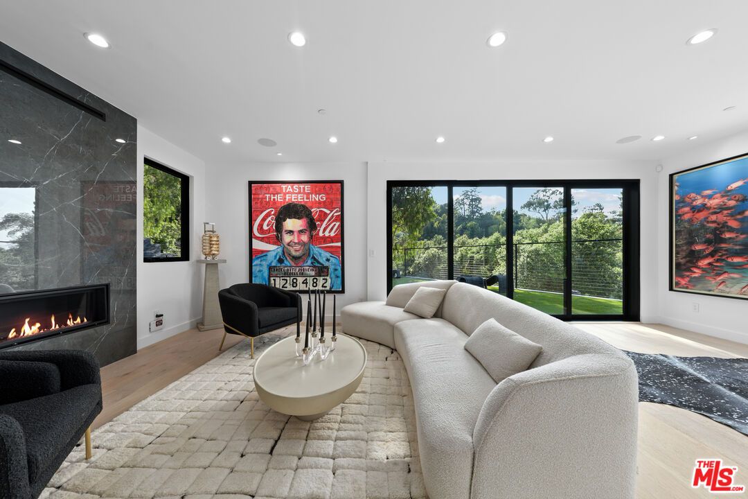 Fireplace, Interior, Living room, Marble Walls, Recessed Lighting, Wood Texture Flooring