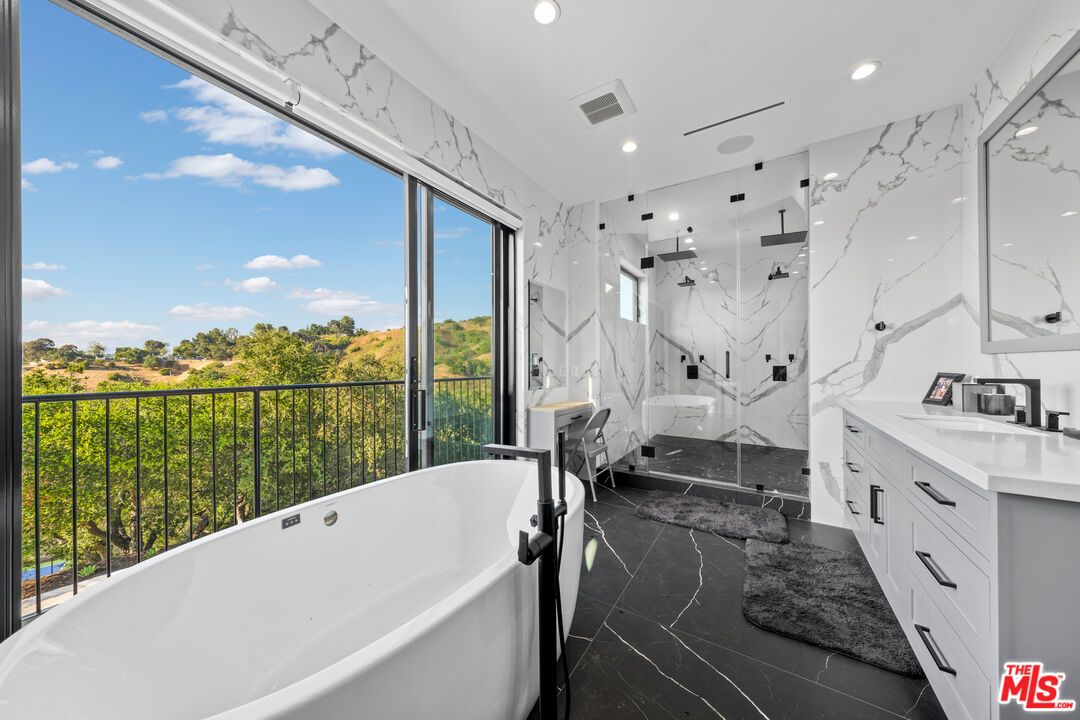 Bathroom, Dual Sink Vanities, Free Standing Baths, Glass Shower, Interior, Marble, Marble Walls, Recessed Lighting