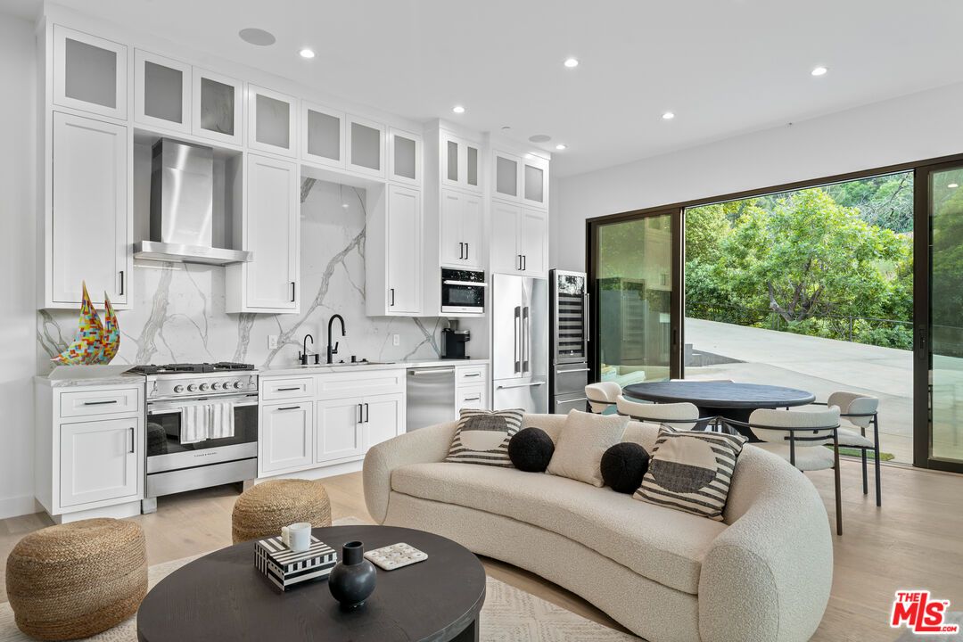 Dining room, Interior, Kitchen, Living room, Marble Walls, Recessed Lighting, Stainless Steel Appliances, Wood Texture Flooring