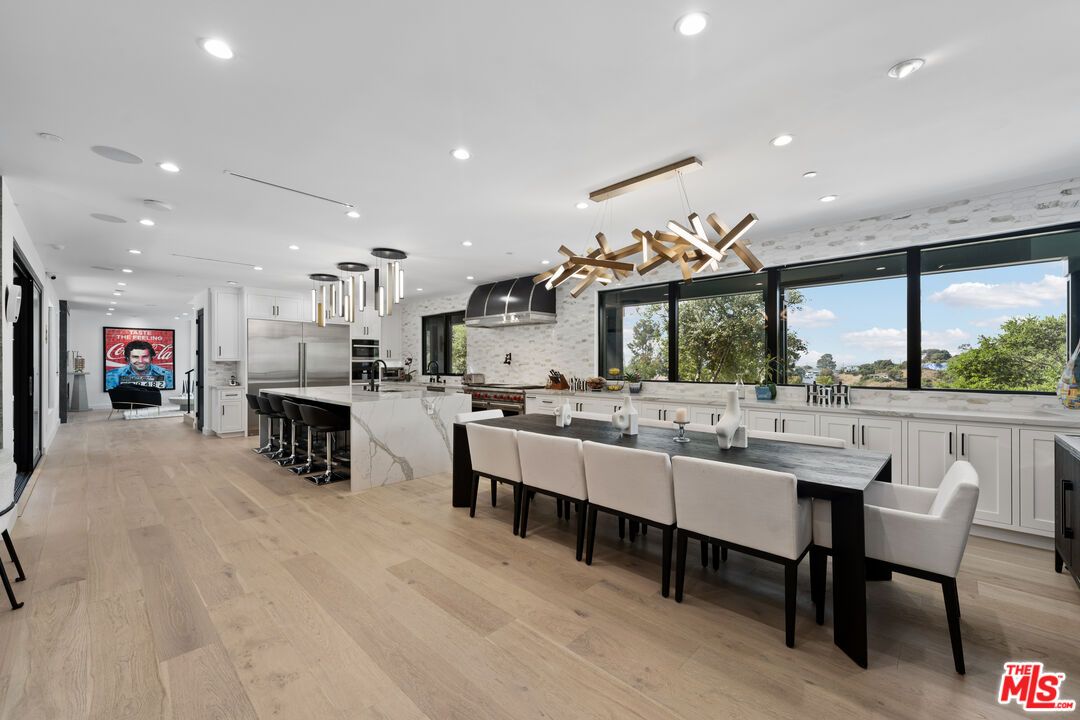 Dining room, Interior, Kitchen, Pendant Lights, Recessed Lighting, Stainless Steel Appliances, Wood Texture Flooring