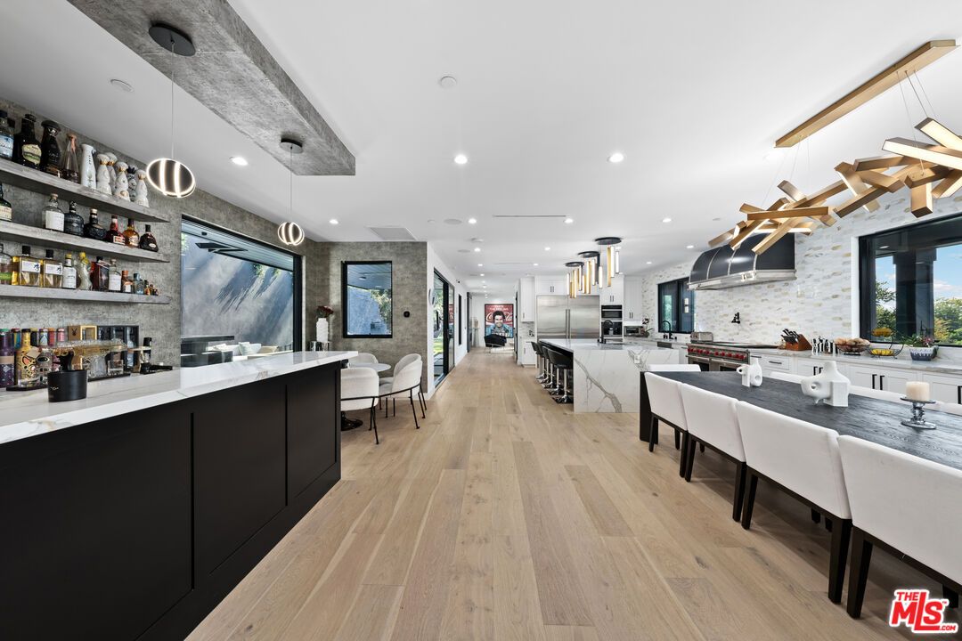 Dining room, Interior, Kitchen, Pendant Lights, Recessed Lighting, Stainless Steel Appliances, Wood Texture Flooring