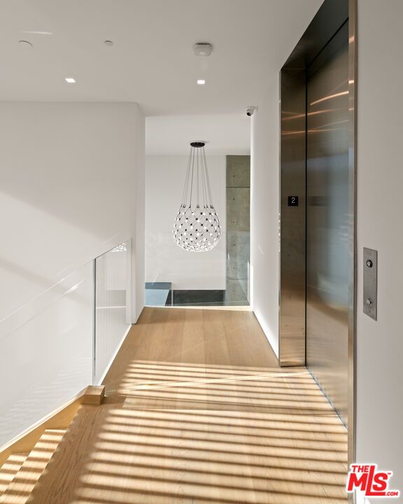 Elevator, Interior, Pendant Lights, Recessed Lighting, Wood Texture Flooring