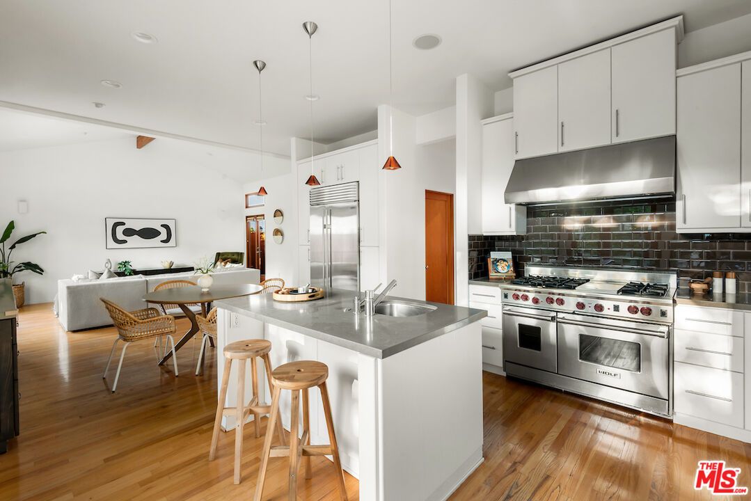 Dining room, Interior, Kitchen, Pendant Lights, Recessed Lighting, Stainless Steel Appliances, Wood Texture Flooring
