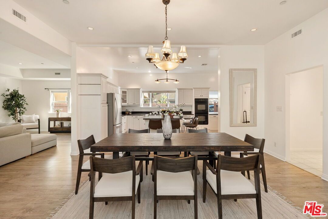 Chandelier, Dining room, Interior, Kitchen, Living room, Recessed Lighting, Stainless Steel Appliances, Wood Texture Flooring