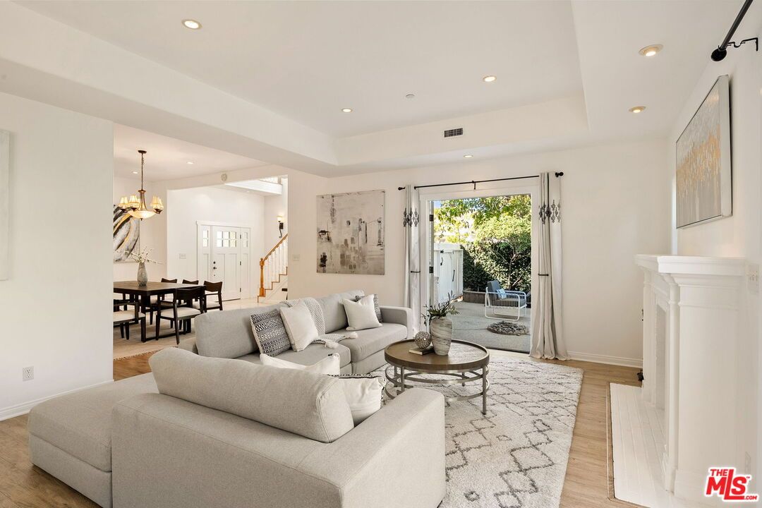 Chandelier, Dining room, Fireplace, Interior, Living room, Recessed Lighting, Wood Texture Flooring