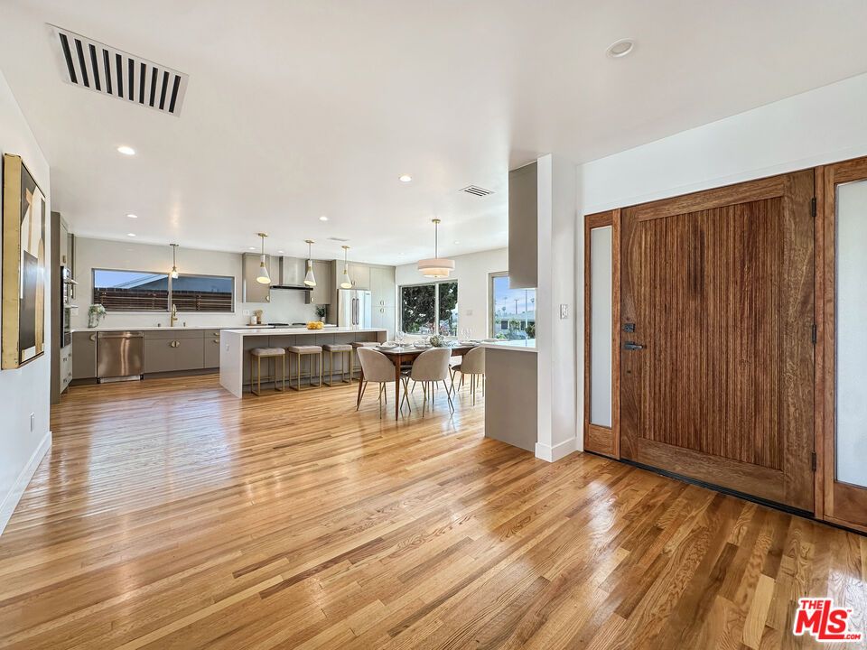 Dining room, Interior, Kitchen, Pendant Lights, Recessed Lighting, Stainless Steel Appliances, Wood Texture Flooring